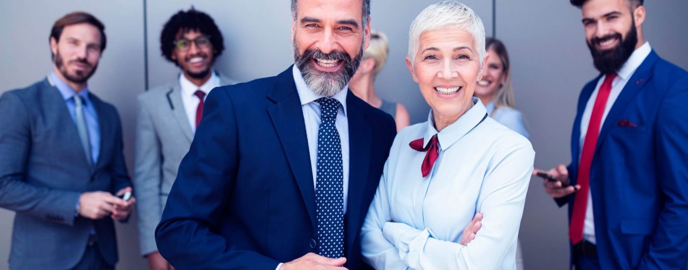 portrait-of-businesspeople-standing-with-arms-7LWEQFP-scaled.jpg